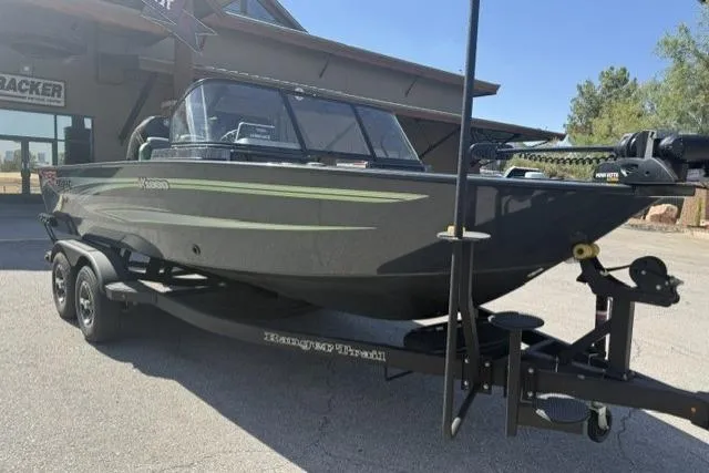 Slide: The Image of 2026 Ranger VX1888 WT boat on trailer, parked outdoors. - 2