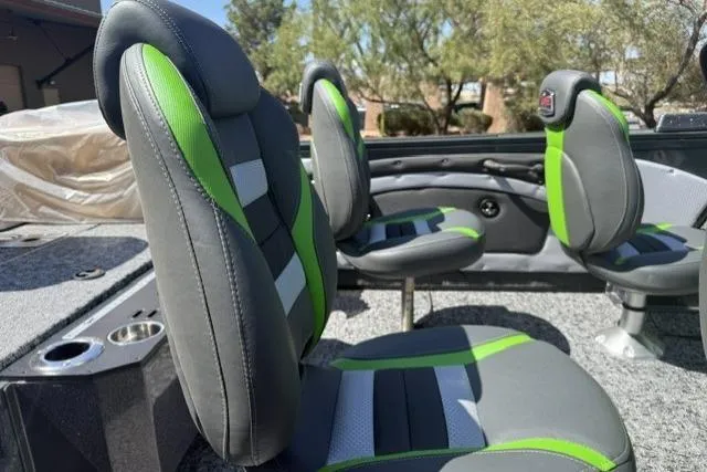 Slide: The Image of 2026 Ranger VX1888 WT boat interior with green and gray seating, showcasing modern design. - 9