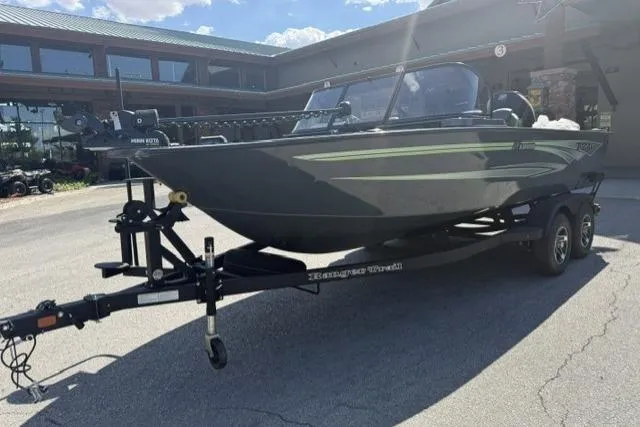 The Image of 2026 Ranger VX1888 WT boat on trailer, parked outdoors under clear sky. - 0