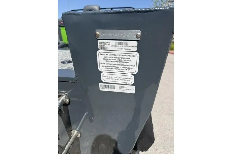 Slide: The Image of 2026 Ranger VX1888 WT boat identification and emissions control labels on a gray surface. - 12