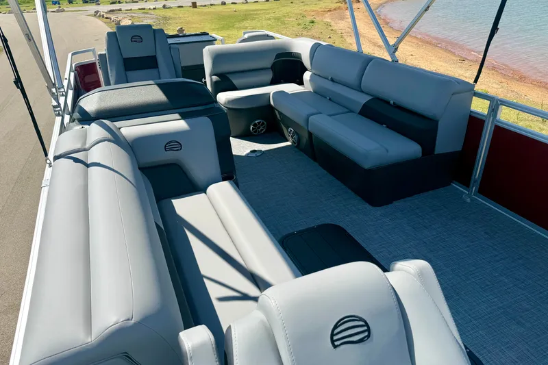 Slide: The Image of 2026 Sun Tracker Sportfish 24 XP3 pontoon boat with spacious seating and modern design. - 9