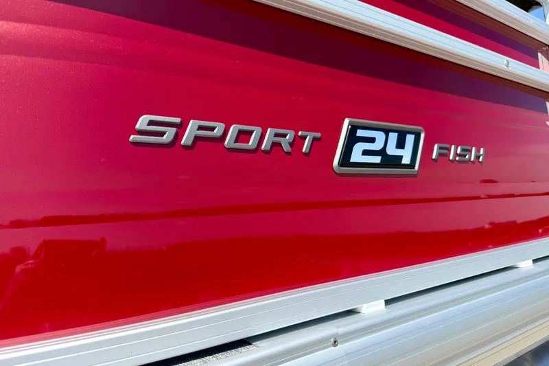 Slide: The Image of Red 2026 Sun Tracker Sportfish 24 XP3 boat with model name displayed. - 13
