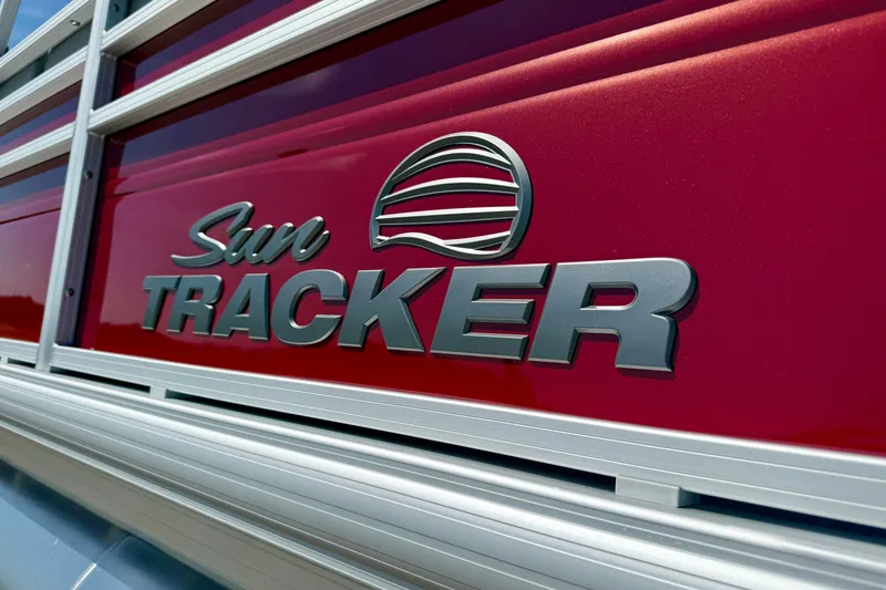 Slide: The Image of Close-up of 2026 Sun Tracker Sportfish 24 XP3 logo on red background. - 14