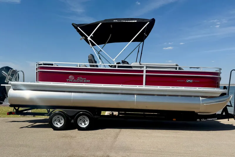 Slide: The Image of 2026 Sun Tracker Sportfish 24 XP3 pontoon boat with canopy on trailer. - 3