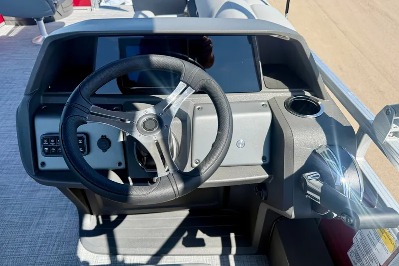 Slide: The Image of Steering console of 2026 Sun Tracker Sportfish 24 XP3 boat with modern controls. - 10