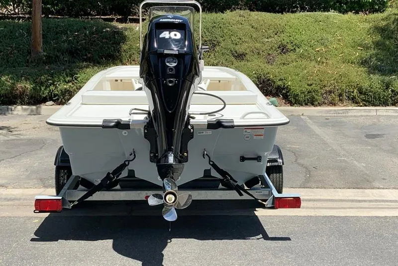 Slide: The Image of 2026 Mako Pro Skiff 13 CC boat on trailer with 40 HP outboard motor. - 6