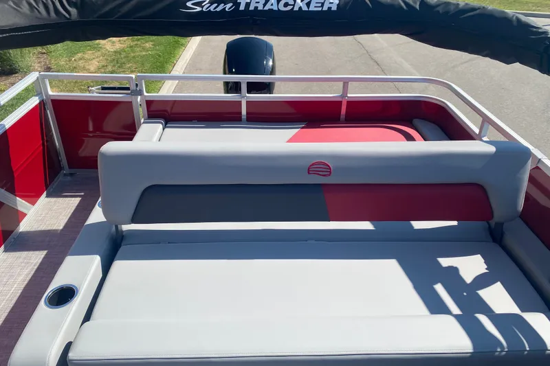 Slide: The Image of 2026 Sun Tracker Party Barge 22 RF XP3 interior with red and gray seating. - 7