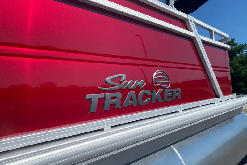 Slide: The Image of Red Sun Tracker Party Barge 22 RF XP3, 2026 model, with sleek metallic logo. - 2