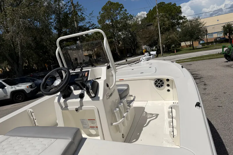 Slide: The Image of 2026 Mako 18 Pro Skiff boat interior with steering console and seating. - 4