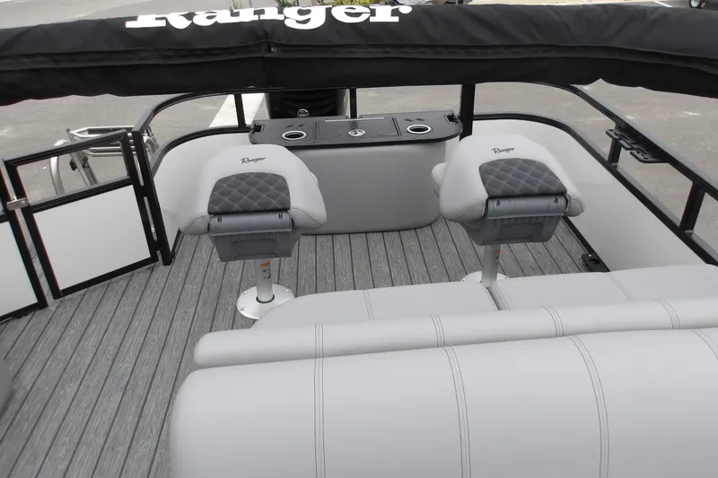 Slide: The Image of 2026 Ranger 220F boat interior with seating and console, featuring modern design and comfort. - 15
