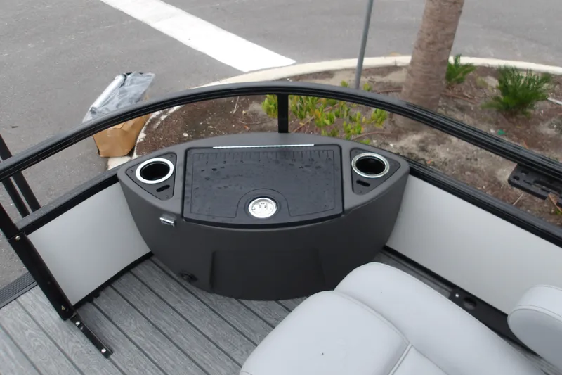Slide: The Image of 2026 Ranger 220F boat interior with cup holders and seating. - 26