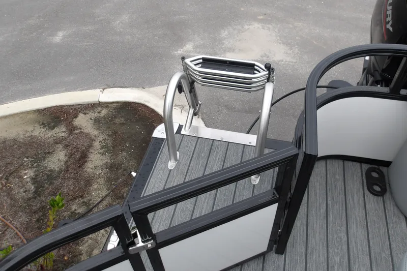Slide: The Image of 2026 Ranger 220F boat with foldable ladder and sleek deck design. - 20
