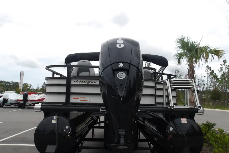 Slide: The Image of 2026 Ranger 220F pontoon boat with powerful outboard motor in a scenic outdoor setting. - 31