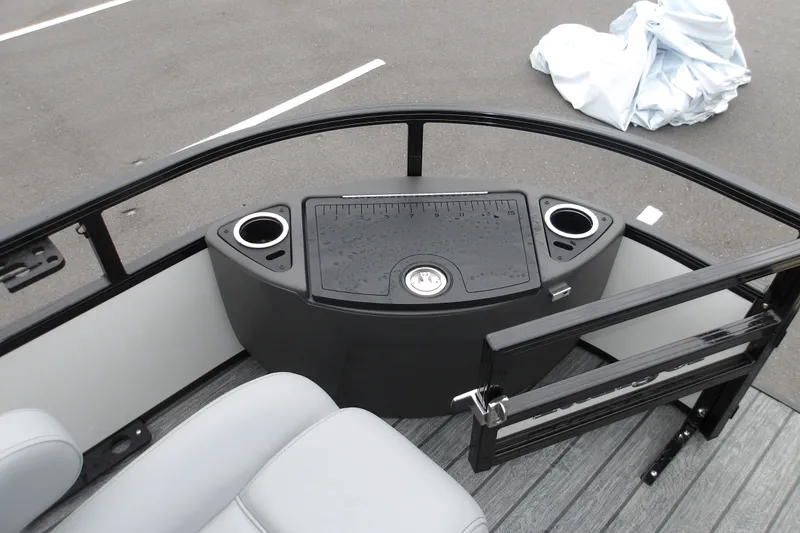 Slide: The Image of 2026 Ranger 220F boat interior with seating, cup holders, and storage compartment. - 27