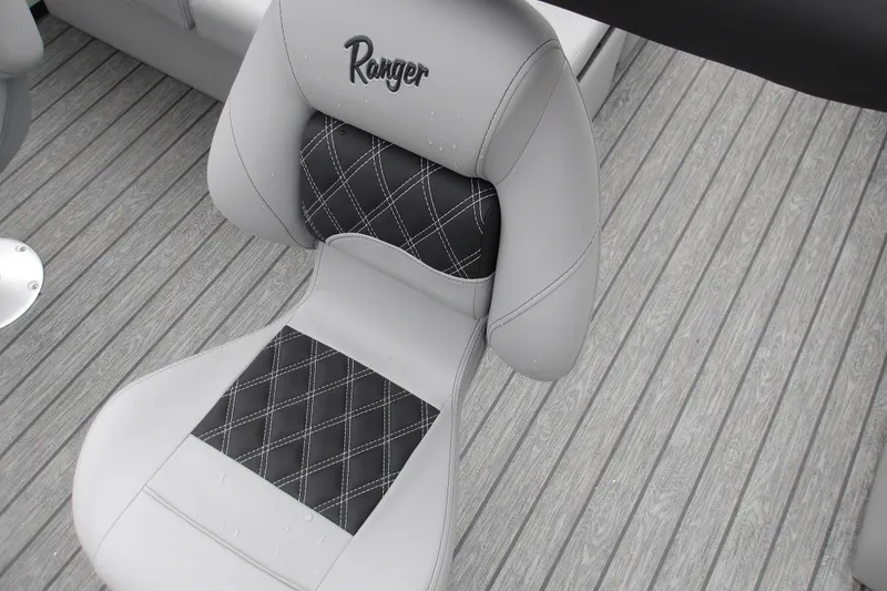 Slide: The Image of Luxurious Ranger 220F 2026 boat seat with diamond-stitched design on gray deck. - 22