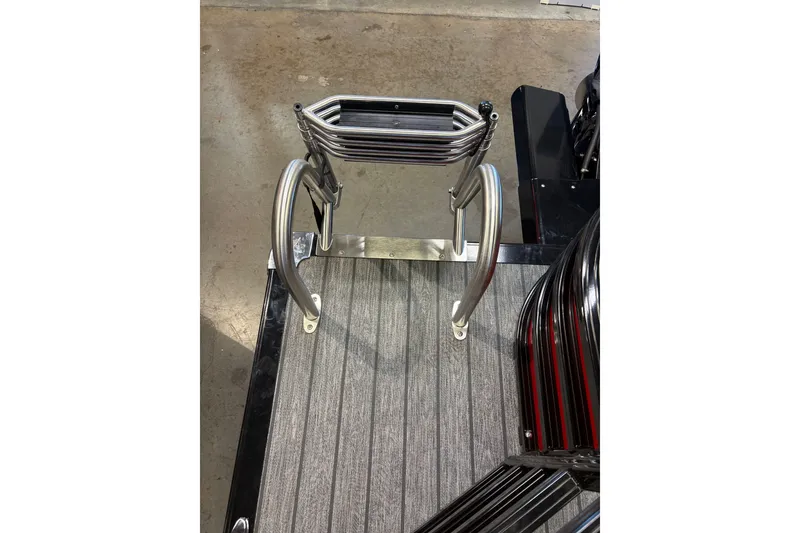 Slide: The Image of Stainless steel boat ladder on 2026 Ranger 223F deck, viewed from above. - 17