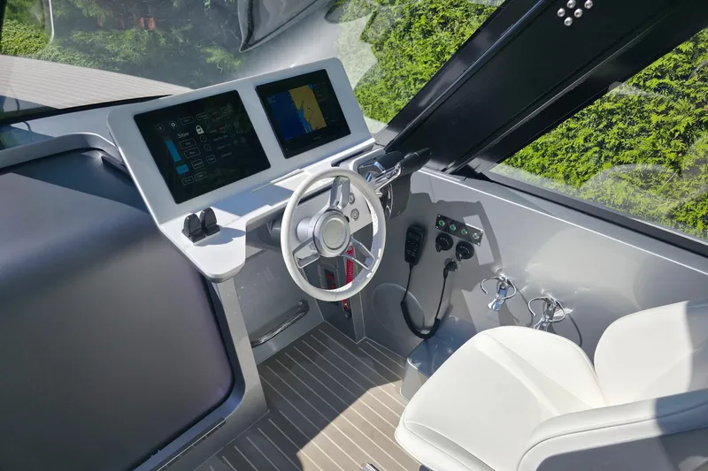 Slide: The Image of Interior cockpit of 2025 Iguana Commuter with modern controls and dual screens. - 6