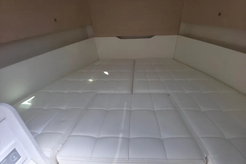 Slide: The Image of Luxurious interior cabin of 2025 Iguana Commuter with plush white seating. - 7