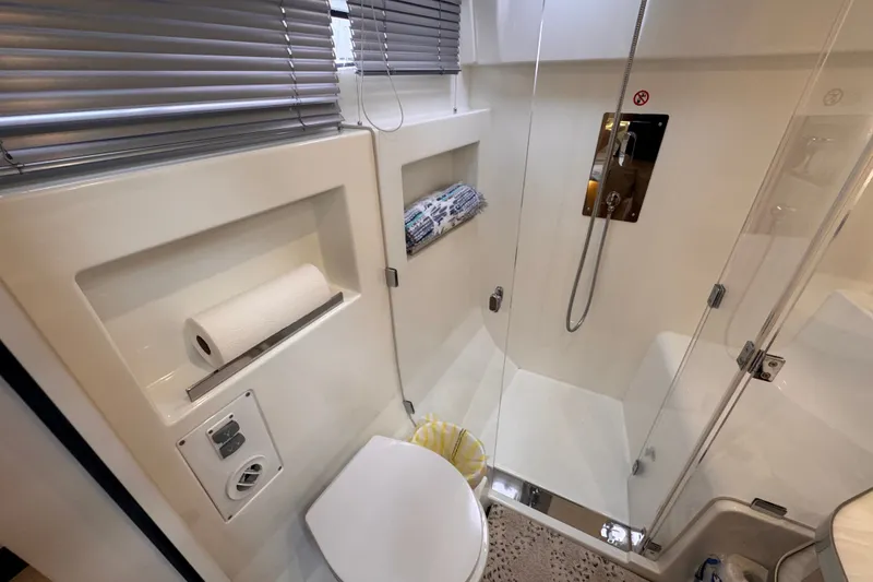 Slide: The Image of Modern bathroom in 2025 Four Winns TH36 yacht with shower and toilet. - 29