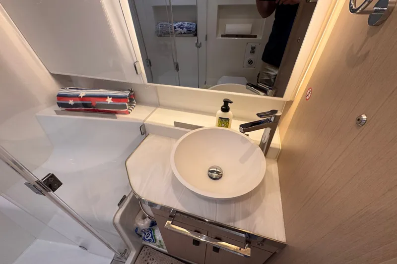 Slide: The Image of Modern bathroom in 2025 Four Winns TH36 yacht with sleek sink and stylish fixtures. - 28