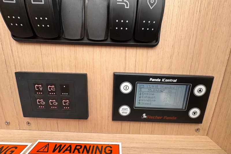 Slide: The Image of Control panel of a 2025 Four Winns TH36 boat with Fischer Panda iControl display. - 35