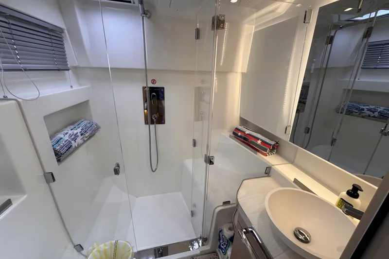 Slide: The Image of Modern bathroom in 2025 Four Winns TH36 yacht with sleek shower and sink. - 27