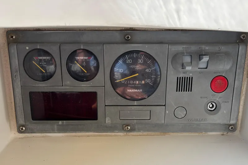 Slide: The Image of Control panel of a 2002 Passport 470 Center Cockpit with Yanmar engine gauges. - 26