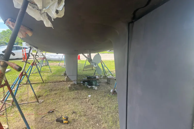Slide: The Image of Underneath view of a 2002 Passport 470 Center Cockpit sailboat on stands. - 88
