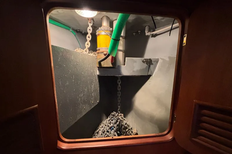 Slide: The Image of Anchor chain locker inside 2002 Passport 470 Center Cockpit sailboat. - 85