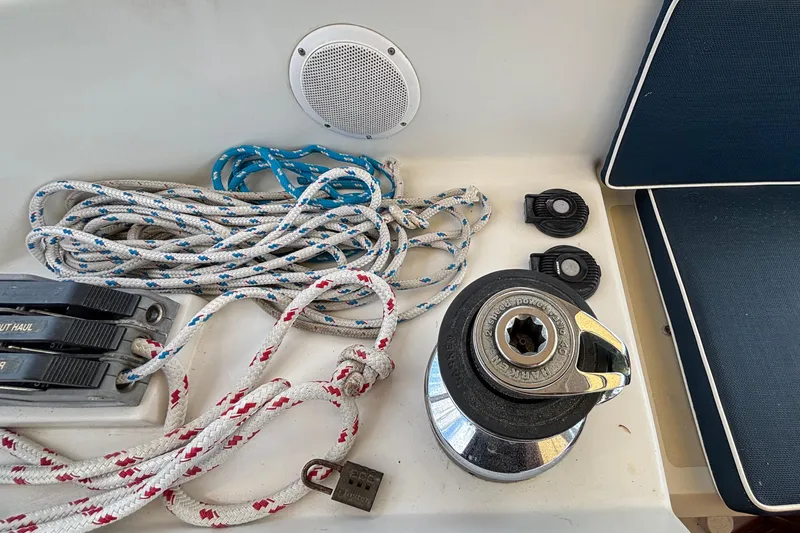 Slide: The Image of Sailing equipment on a 2002 Passport 470 Center Cockpit, featuring ropes and winch. - 36