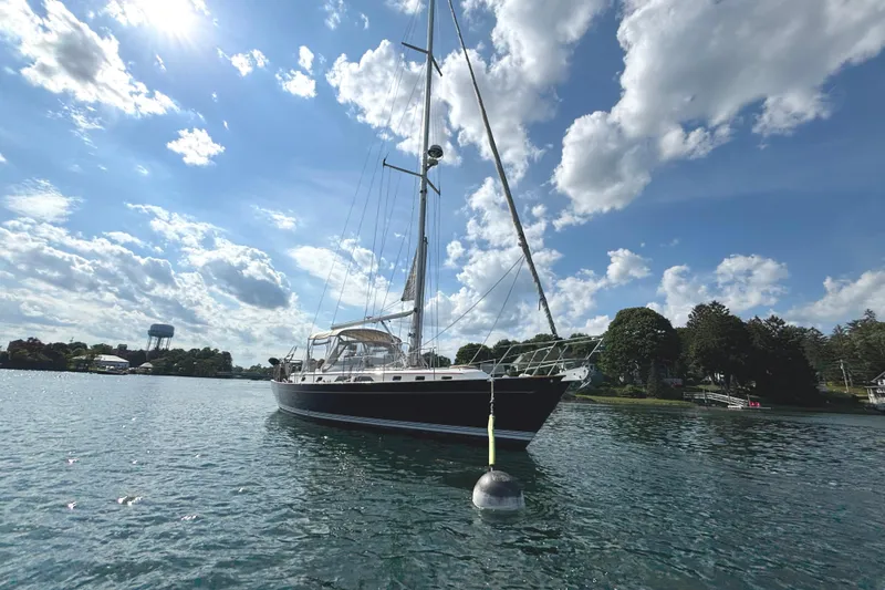 Slide: The Image of Sailboat on water under blue sky, Passport 470 Center Cockpit, 2002 model. - 7
