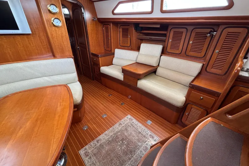 Slide: The Image of Luxurious interior of a 2002 Passport 470 Center Cockpit yacht with elegant wood finishes. - 45