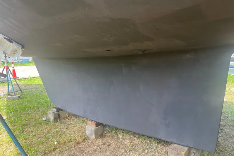 Slide: The Image of Bottom view of a 2002 Passport 470 Center Cockpit sailboat on blocks. - 90