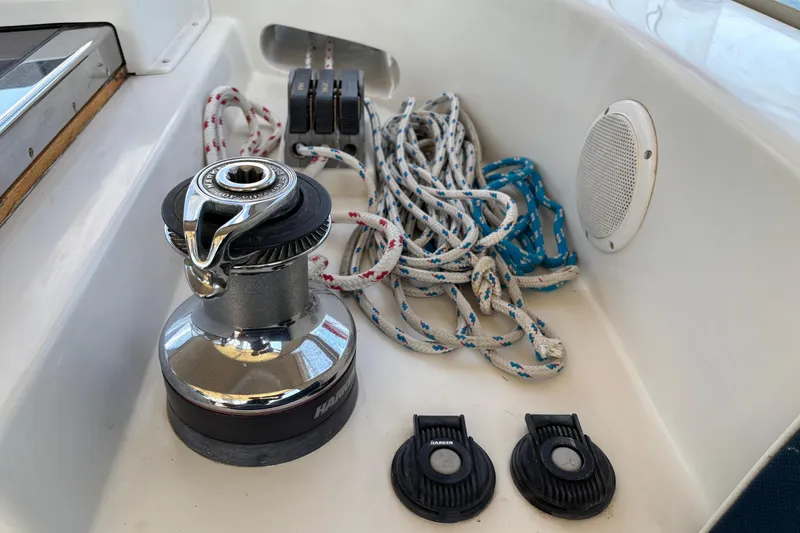 Slide: The Image of Winch and ropes on 2002 Passport 470 Center Cockpit sailboat deck. - 34