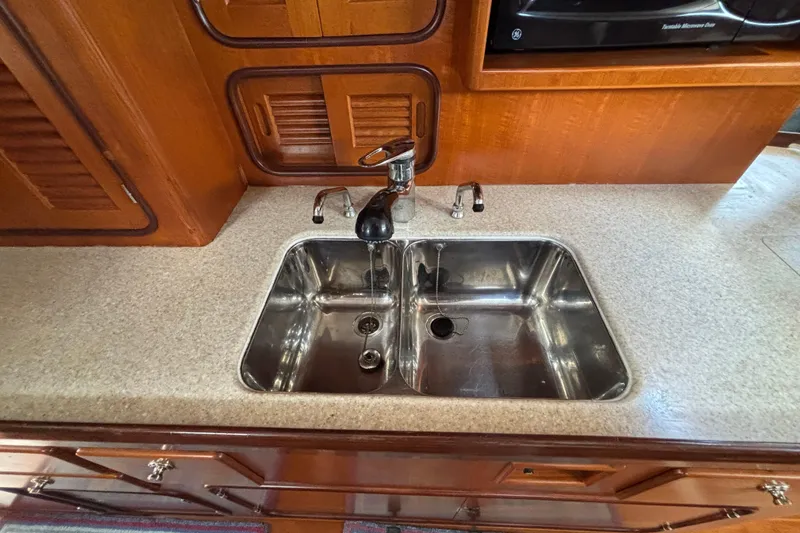 Slide: The Image of Stainless steel sink in 2002 Passport 470 Center Cockpit yacht kitchen. - 59