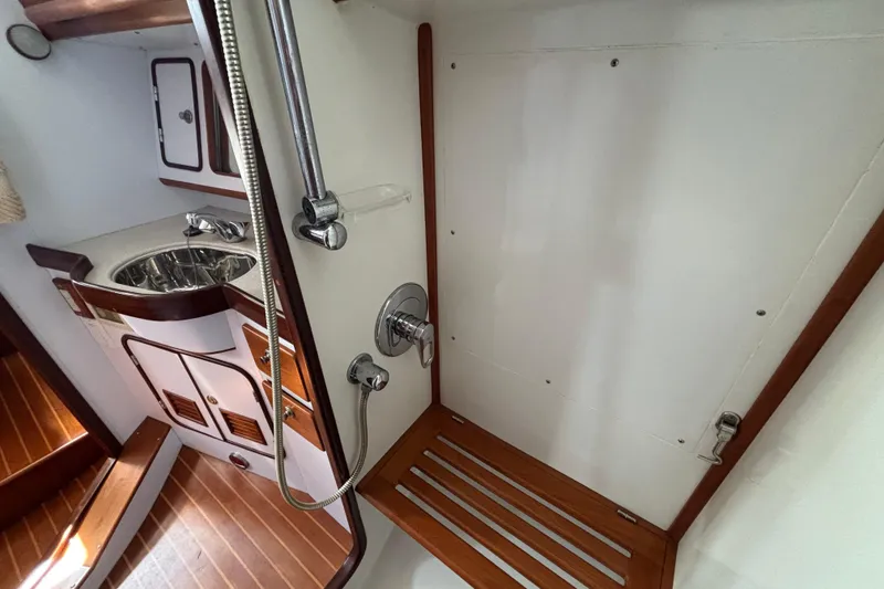 Slide: The Image of Interior of 2002 Passport 470 Center Cockpit yacht bathroom with shower and sink. - 68