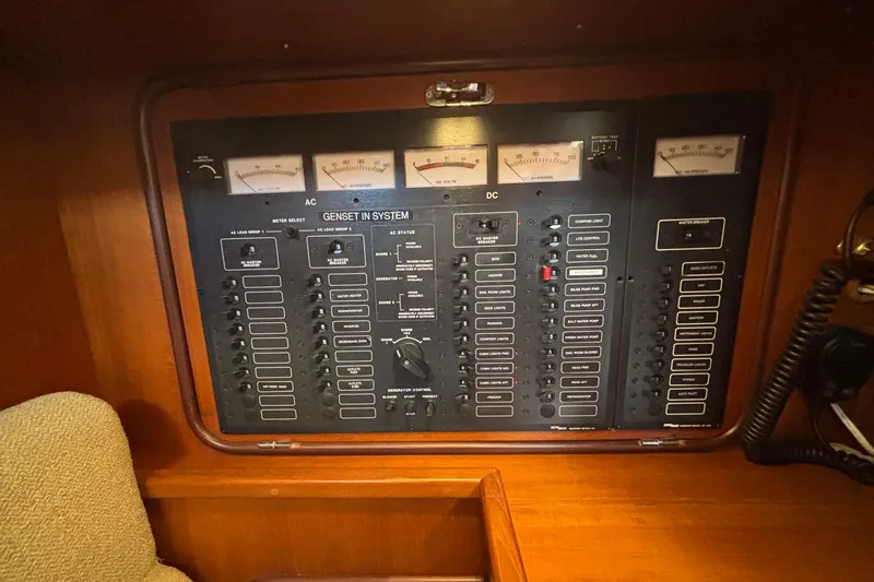 Slide: The Image of Electrical control panel on a 2002 Passport 470 Center Cockpit yacht. - 49