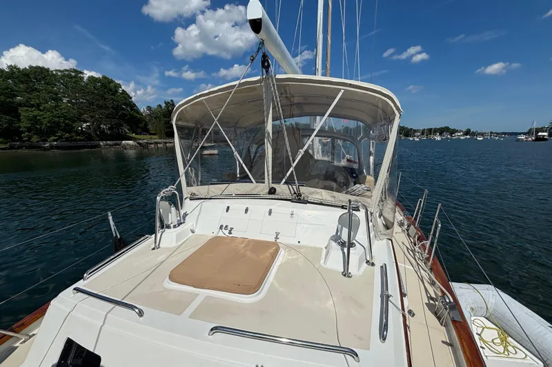 Slide: The Image of Sailboat on calm water, Passport 470 Center Cockpit, 2002 model, clear sky, scenic view. - 12