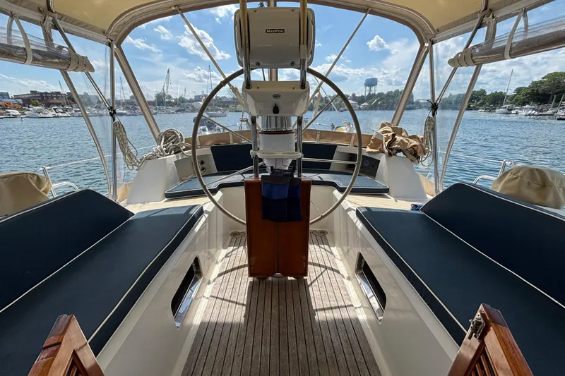 Slide: The Image of Center cockpit of a 2002 Passport 470 sailboat with scenic marina view. - 20
