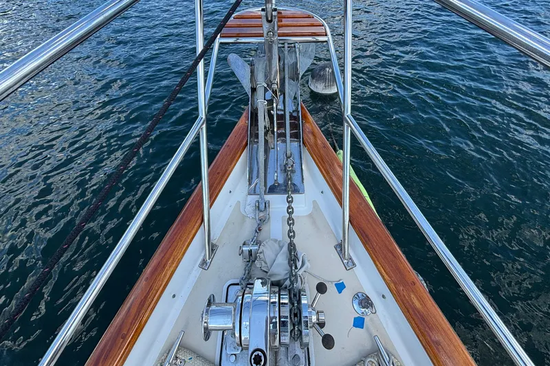 Slide: The Image of Bow of 2002 Passport 470 Center Cockpit sailboat with anchor and winch system. - 31