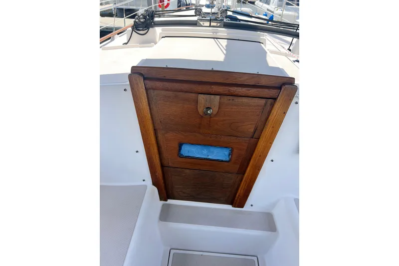 Slide: The Image of Wooden hatch door on 1987 Island Packet SP Cruiser sailboat deck. - 41
