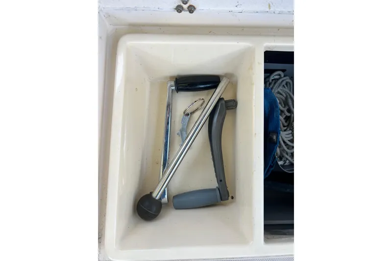 Slide: The Image of Compartment with tools and rope on a 1987 Island Packet SP Cruiser. - 36