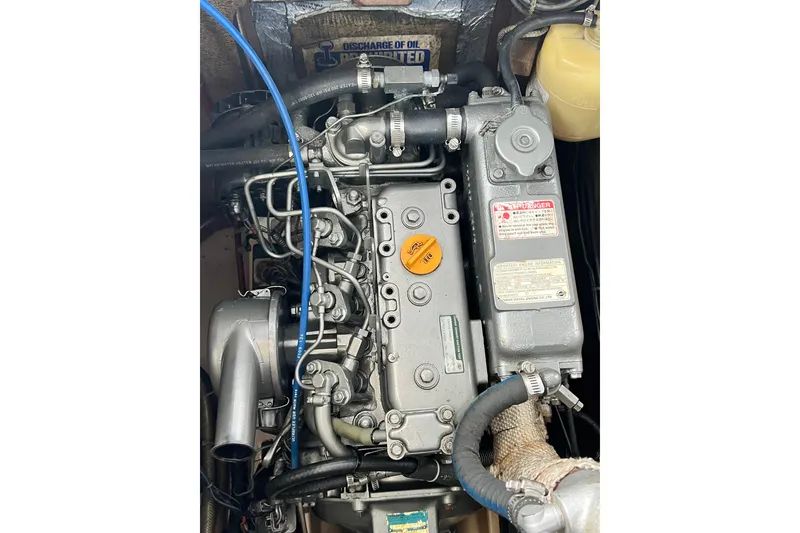 Slide: The Image of Engine of a 1987 Island Packet SP Cruiser sailboat, showcasing detailed components. - 79