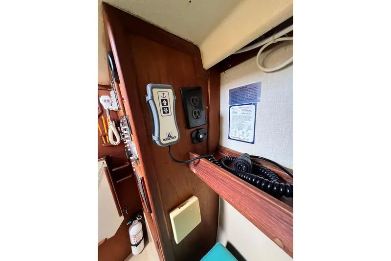 Slide: The Image of Control panel and equipment inside a 1987 Island Packet SP Cruiser sailboat cabin. - 47