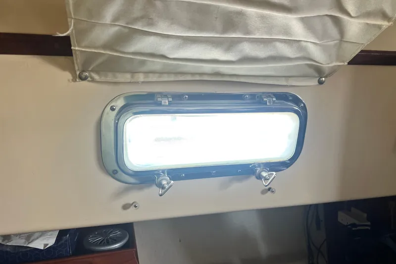 Slide: The Image of Portlight window inside 1987 Island Packet SP Cruiser sailboat cabin. - 67