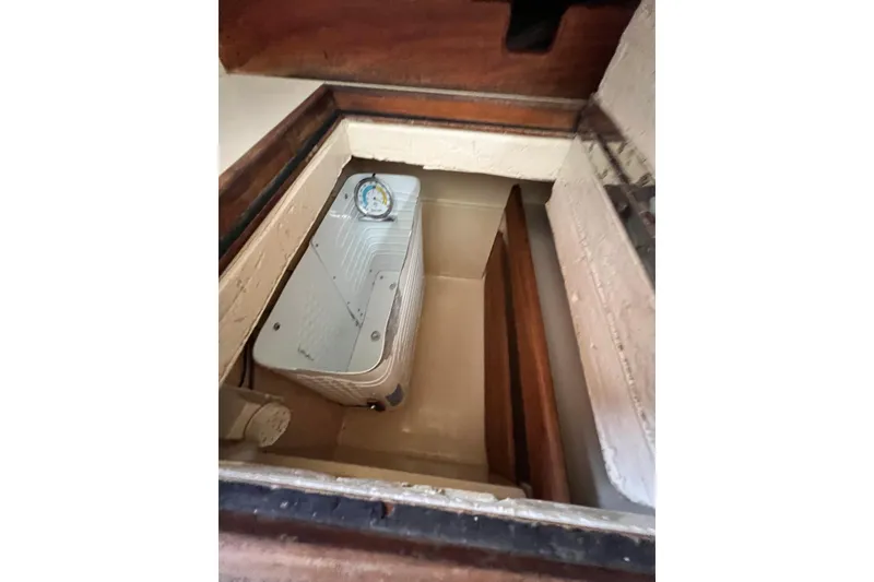 Slide: The Image of 1987 Island Packet SP Cruiser interior compartment with gauge and wooden finish. - 56
