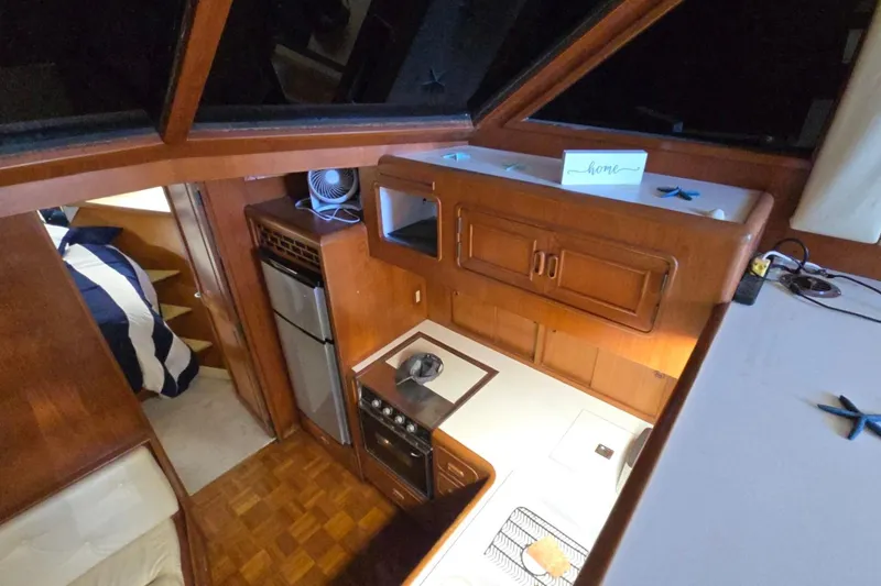 Slide: The Image of Interior of 1990 Pace 42 yacht kitchen with wood cabinetry and modern appliances. - 35