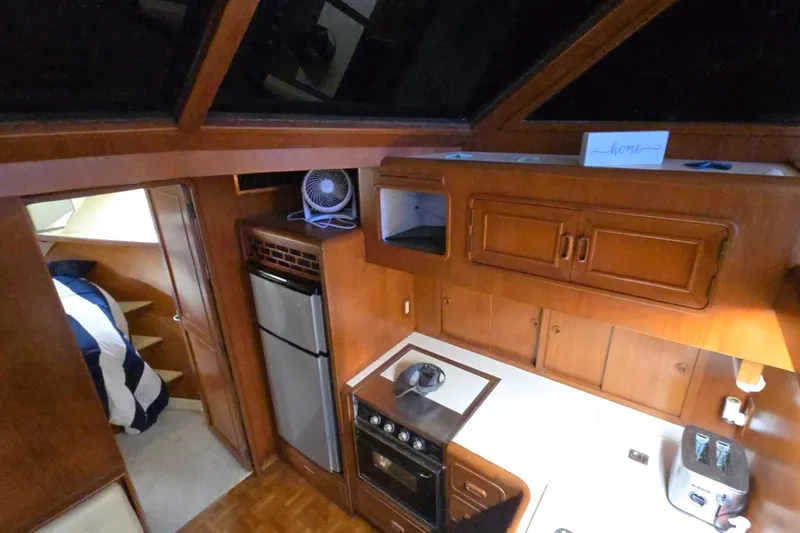 Slide: The Image of Interior of 1990 Pace 42 yacht with kitchen and cozy sleeping area. - 28
