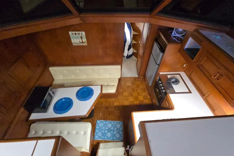 Slide: The Image of Interior of a 1990 Pace 42 yacht with kitchen and dining area. - 26