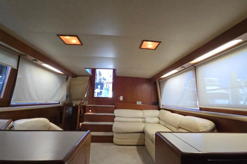 Slide: The Image of Interior of 1990 Pace 42 yacht with beige seating and wooden accents. - 19
